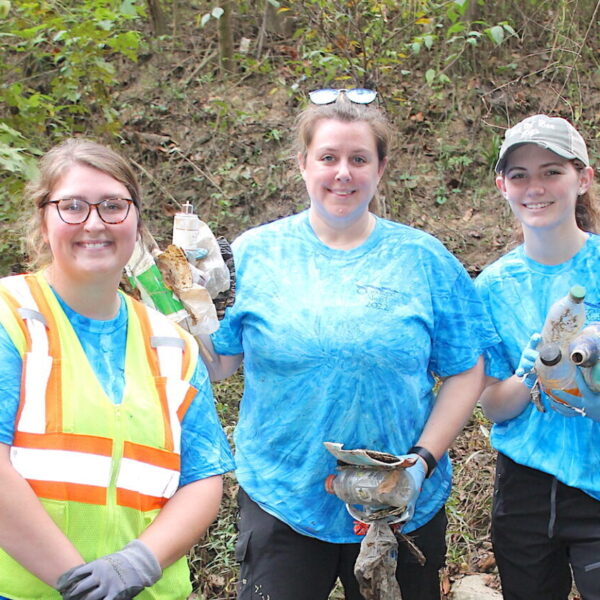L to R: Natalie McEver, MWA Supervisor of Environmental Compliance, helps organize the annual Ocmulgee Alive! river cleanup. Among the volunteers last year were teacher Candace Bridges and student Zoe Boychuk from Stratford Academy.